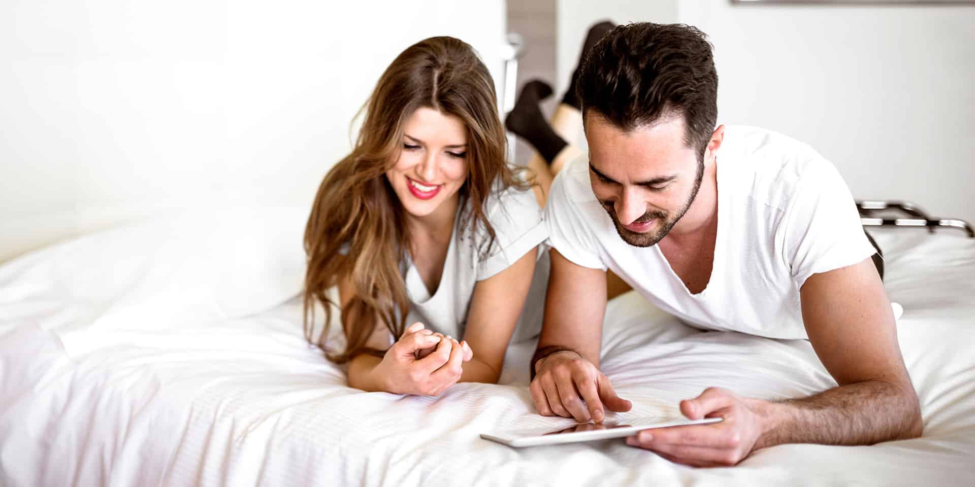young-couple-on-bed